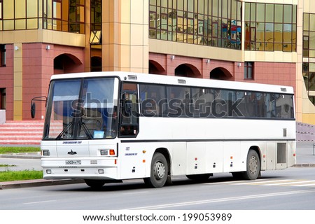 NOVYY URENGOY, RUSSIA - AUGUST 15, 2012: White MAZ 152 interurban coach at the city street.