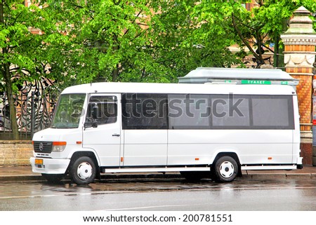 SAINT PETERSBURG, RUSSIA - MAY 25, 2013: White Mercedes-Benz 814D Vario interurban coach at the city street.