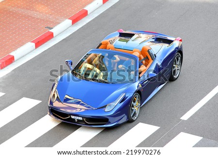 MONTE CARLO, MONACO - AUGUST 2, 2014: Blue sports car Ferrari 458 Italia Spider at the city street.