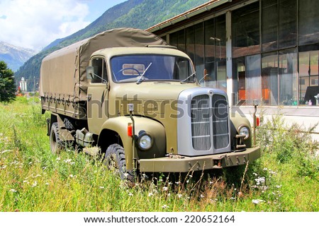 SWITZERLAND - AUGUST 5, 2014: Swiss army truck Saurer at the small Alpine village.