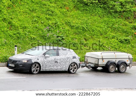 TYROL, AUSTRIA - JULY 29, 2014: Camouflaged prototype of the 2016 Opel Astra during the tests at the Grossgloeckner High Alpine road.