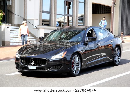 MONTE CARLO, MONACO - AUGUST 2, 2014: Black luxury sedan Maserati Quattroporte at the city street.