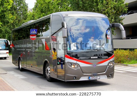 VENICE, ITALY - JULY 30, 2014: Touristic coach Scania OmniExpress 360 at the city street.