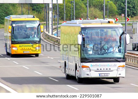 BERLIN, GERMANY -  AUGUST 17, 2014: Modern coach buses Setra 400-series at the interurban freeway.