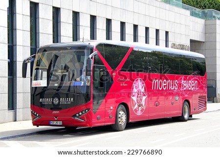 BRUSSELS, BELGIUM - AUGUST 9, 2014: Modern german interurban coach Viseon C13 at the city street.