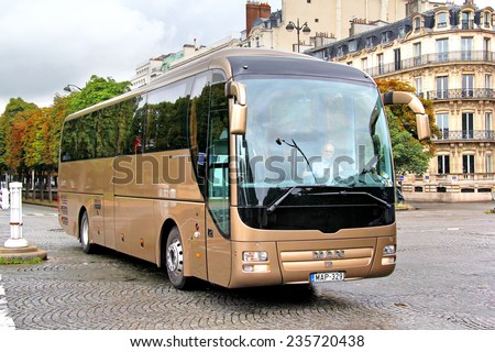 PARIS, FRANCE - AUGUST 8, 2014: Touristic coach MAN R08 Lion\'s Coach at the city street.