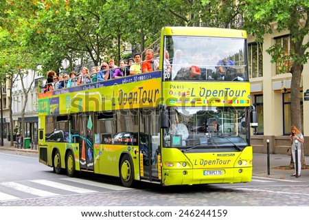 PARIS, FRANCE - AUGUST 8, 2014: Yellow city sightseeing bus Neoplan N4426/3 Centroliner at the city street.