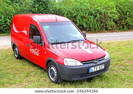 BUDAPEST, HUNGARY - JULY 27, 2014: Coca-Cola designed cargo van Opel Combo at the countryside.