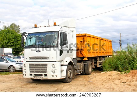 NIZHNY NOVGOROD, RUSSIA - JULY 26, 2014: White semi-trailer truck Ford Cargo 1838T at the city street.