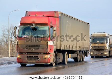 BASHKORTOSTAN, RUSSIA - MARCH 11, 2015: Very dirty semi-trailer truck Renault Premium at the interurban road.