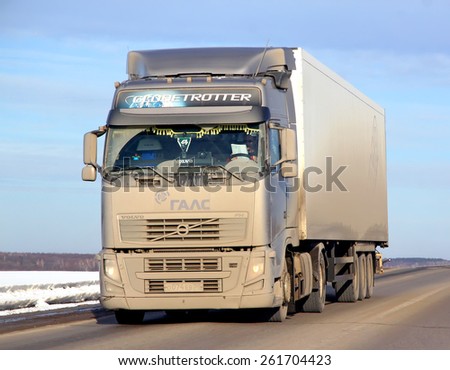 BASHKORTOSTAN, RUSSIA - MARCH 11, 2015: Very dirty semi-trailer truck Volvo FH12 at the interurban road.