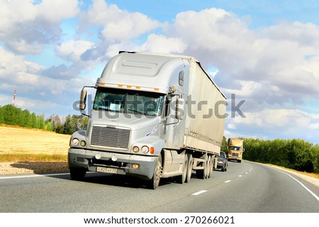 TATARSTAN, RUSSIA - AUGUST 27, 2011: American semi-trailer truck Freightliner Century Class at the interurban freeway.