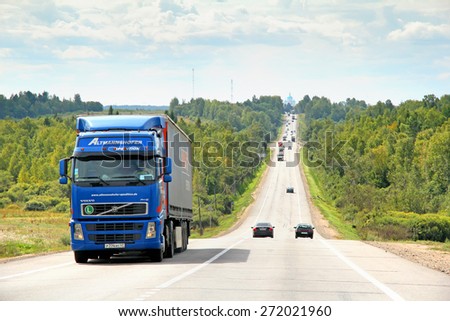 VLADIMIR REGION, RUSSIA - AUGUST 26, 2011: Blue semi-trailer truck Volvo FH12 at the interurban freeway.