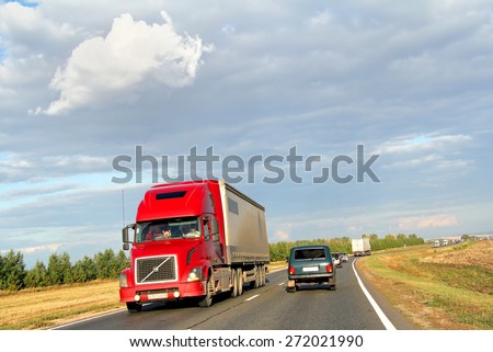 TATARSTAN, RUSSIA - AUGUST 27, 2011: Red semi-trailer truck Volvo VNL64T at the interurban freeway.