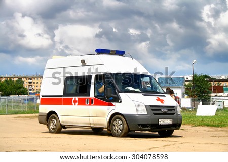 MOSCOW, RUSSIA - JULY 10, 2011: Ambulance car Ford Transit at the gravel city street.