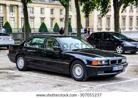 PARIS, FRANCE - AUGUST 8, 2014: Motor car BMW E38 7-series at the city street.