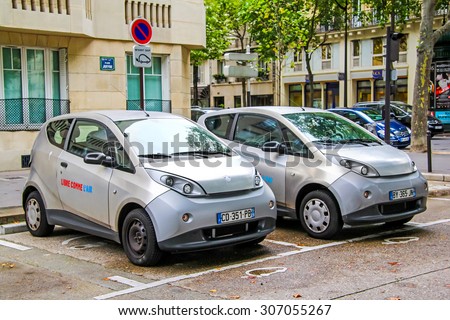 PARIS, FRANCE - AUGUST 8, 2014: Electic cars charging at the city street.
