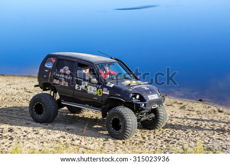 NOVYY URENGOY, RUSSIA - SEPTEMBER 6, 2015: Off-road extremal vehicle Chevrolet Niva at the countryside.