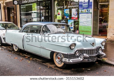 PARIS, FRANCE - AUGUST 8, 2014: Motor car Cadillac Series 62 at the city street.