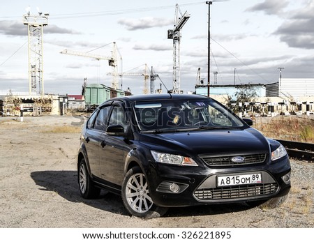 NOVYY URENGOY, RUSSIA - SEPTEMBER 5, 2015: Black motor car Ford Focus in the industrial zone.