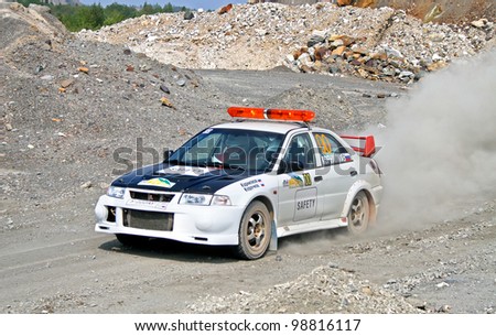 BAKAL, RUSSIA - AUGUST 13: Safety car Mitsubishi Lancer Evolution V takes part at the annual Rally Southern Ural on August 13, 2010 in Bakal, Satka district, Chelyabinsk region, Russia.