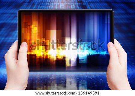 Abstract tablet pc with equalizer on screen in hands, multimedia gadget