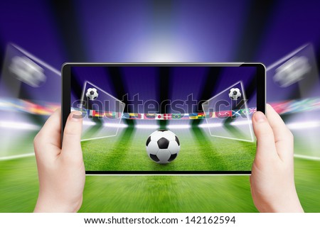 Abstract technology background - tablet pc, computer in hands, soccer ball, sports game online, soccer online, augmented reality