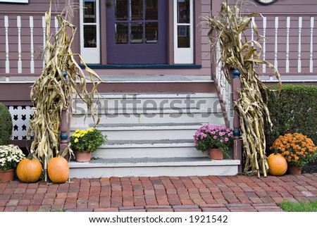 Front Porch steps decorated for the fall season.