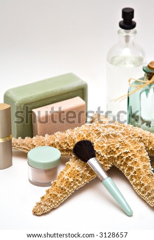 Cosmetic layout featuring makeup, spray, soaps.
