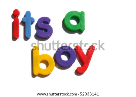 its a boy - colored fridge magnets on white background