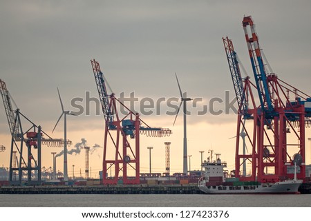 Hamburg harbour and wind power  on sunset