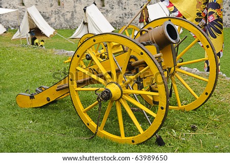 An ancient yellow cannon guarding the battlefield