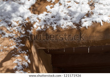 Snow piles up on Santa Fe\'s adobe walls in winter