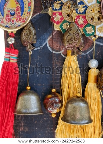 Similar – Image, Stock Photo Copper bells, different sizes on a wooden stick