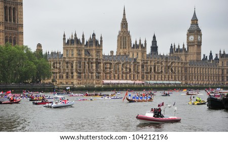 LONDON - JUNE 3rd 2012: Various boats take parrt in Queen Elizabeth Diamond Jubilee River Pageant on June 3rd 2012 in London