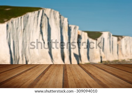 Landscape of Seven Sisters cliffs in South Downs National Park on English coast with wooden planks floor