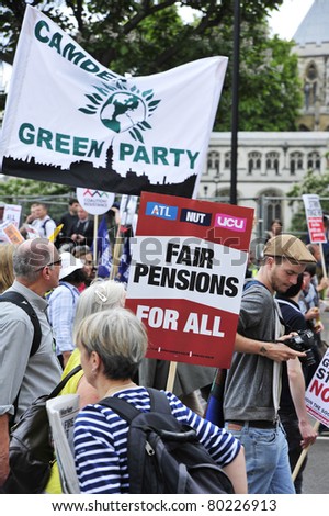 LONDON - JUNE 30; Unidentified members of trade unions hold placards in protest against government spending cuts during a protest organised by PCS and NUT unions in London on June 30, 2011