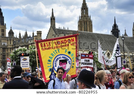 LONDON - JUNE 30; Unidentified members of trade unions outside parliament protesting against government cuts during a demonstration  organised by PCS and NUT trade unions in London on June 30, 2011