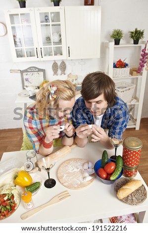 Portrait of a young couple preparing meat dumplings