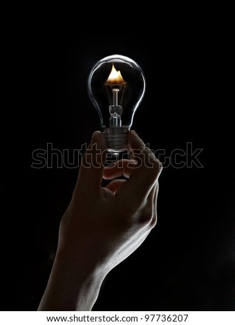 Burning lamp in his hand