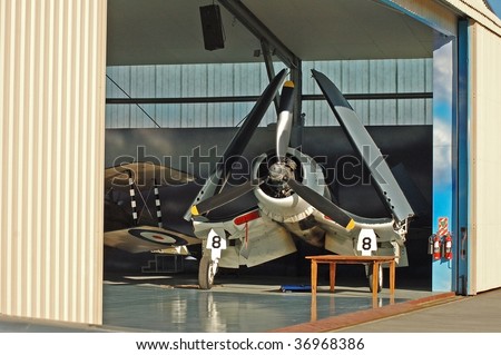 Aircraft carrier based fighter aircraft in hangar