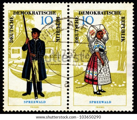 EAST GERMANY (DDR) - CIRCA 1966: Two stamps printed in East Germany show regional costumes of Spreewald region, East Germany, circa 1966