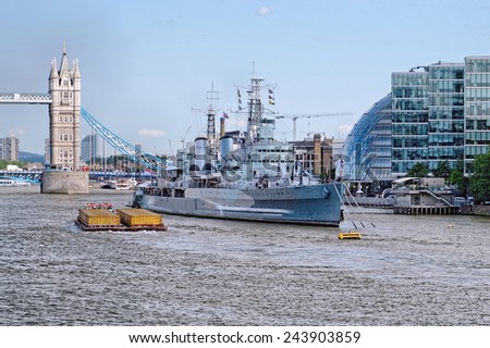 LONDON - JULY 1, 2014: HMS Belfast (Royal Navy light cruise) in London, UK. Belfast, used as floating museum is moored in the Thames River, operated by the Imperial War Museum.