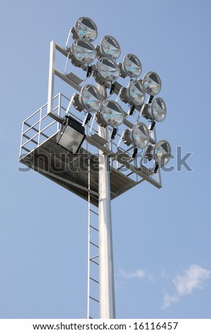 Group of flood lights next to a swimming pool