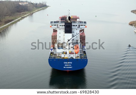 VARNA, BULGARIA - JANUARY 20: Cargo ship CALISTO (Flag: Liberia, IMO: 9306067) sails into Port of Varna-West to be loaded with containers on January 20, 2011 in Varna, Bulgaria.
