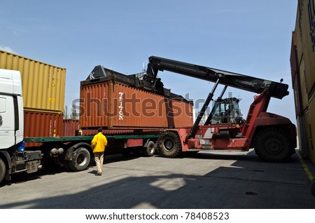 VARNA, BULGARIA - MAY 12: Forklift truck moves containers on May 12, 2011 in Varna, Bulgaria. The market share of processed containers in Port of Varna in the Black Sea region had fallen below 6 %.