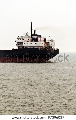 VARNA, BULGARIA - MARCH 11: Cargo ship BATYA (ex DURRINGTON), Year Built: 1981, Flag: Bulgaria sails away after a short stay at MTG-DOLPHIN for conversion work on March 11, 2011 in Varna, Bulgaria.