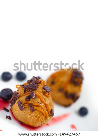 cakes with caramel and blueberries. Focus in front of cake