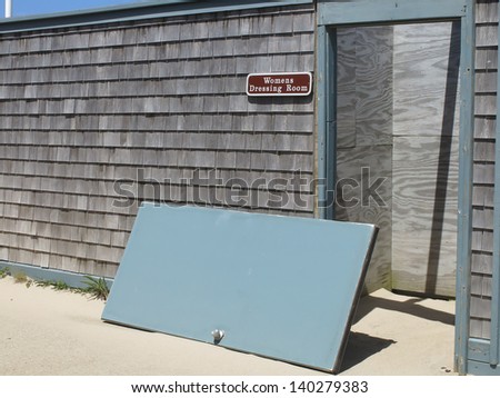 The end of privacy? Door rests by entrance to women\'s dressing room at public beach