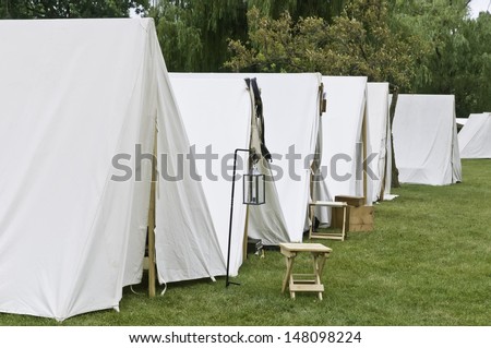 Row of white tents in Union camp at reenactment of American Civil War (1861-1865), Four Seasons Park, Lombard, Illinois, on July 27, 2013. Typically, the volunteer actors sleep in such tents at night.